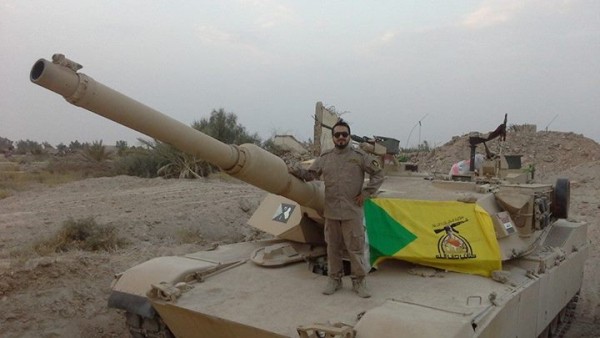 M1A1-Abrams-tank-draped-in-Hezbollah-flag-e1420750328467.jpg