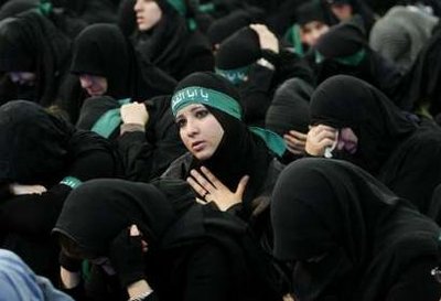 Female members of Lebanon's Hezbollah cry during the Ashura ceremony held in Beirut's suburbs December 27, 2009.