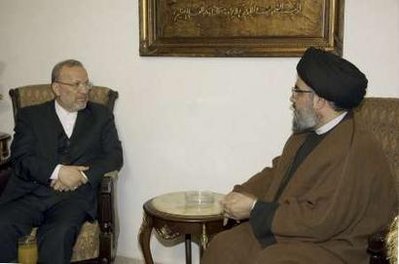 Lebanon's Hezbollah leader Sayyed Hassan Nasrallah (R) meet Iran's Foreign Minister Manouchehr Mottaki in Beirut December 21, 2009.