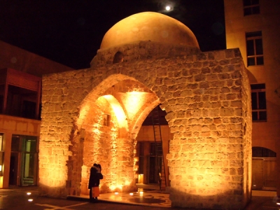 A Lebanese couple snuggles in front of the Mamluk shrine located in downtown Beirut. (Erin Cole/Montana Kaimin)