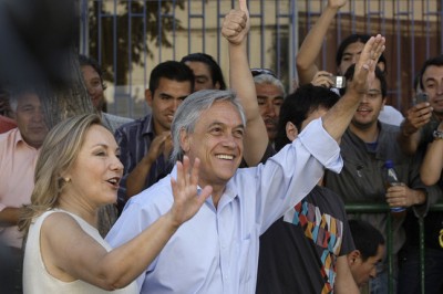 Billionaire presidential candidate Sebastian Piñera waved with his wife, Cecilia Morel, after voting Sunday in Santiago during a runoff election.