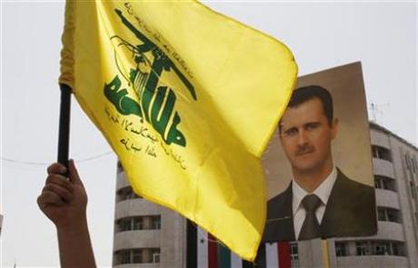 Hezbollah flag- assad poster