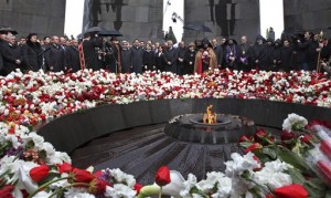 Armenians lay flowers at a memorial to Armenians killed by the Ottoman Turks, as they mark the 95th anniversary of the mass killings, in Yerevan, Armenia, Saturday, April 24, 2010.