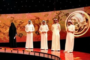 Saudi poet Hissa Hilal (L) stands next to the other contestants during the final episode of the talent show 'Million's Poet' in Abu Dhabi late on 07 Apr 2010 