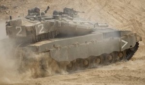 An Israeli tank maneuvers near the site of an exchange of fire between Israeli and Lebanese troops along the border between Israel and Lebanon, Tuesday, Aug. 3, 2010.