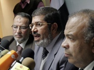 Senior members of Egypt's Muslim Brotherhood Saad el-Katatni, right, Mohamed Morsi, centre, and Essam el-Erian hold a press conference on the latest situation in Egypt in Cairo, Egypt, Wednesday, Feb. 9, 2011