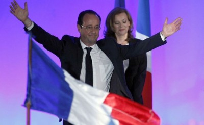 France’s newly-elected President Francois Hollande (L) celebrates on stage with his companion Valerie Trierweiler after results in the second round vote of the 2012 French presidential elections in Tulle May 6, 2012. (Reuters)
