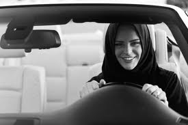 A Saudi woman  is driving a car in defiance of Saudi laws