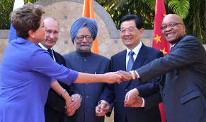 (L to R) Brazilian President Dilma Roussef, Russian President Vladimir Putin, Indian Prime Minister Manmohan Singh, Chinese President Hu Jintao and South African President Jacob Zuma join their hands during a BRICS's Presidents meeting in Los Cabos, Baja California, Mexico on June 18, 2012 before the opening of the G20 leaders Summit. (Roberto Stuckert Filho/AFP/Getty Images)