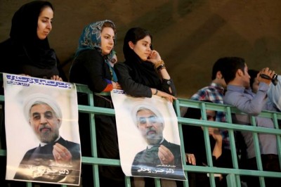 Female supporters of the Iranian presidential candidate Hasan Rowhani, a former top nuclear negotiator, seen on poster, at a rally in Tehran, Iran, Saturday, June 1, 2013. The 11th presidential election after Iran's 1979 Islamic Revolution, will be held on June 14. Photo: Ebrahim Noroozi 