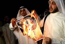 kuwaitis set nasrallah's picture on fire