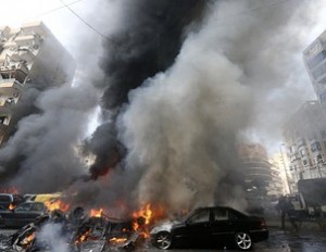 Smoke rises from burning cars at site of an explosion in Beirut's southern suburb neighbourhood of Bir al-Abed on July 9, 2013.  A car bomb rocked Beirut's southern suburbs, stronghold of Lebanon's Shiite Hezbollah movement,  wounding 15 people, television reports and a military source said. AFP PHOTO/STR        (Photo credit should read -/AFP/Getty Images)