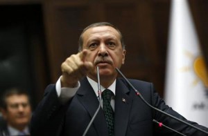 Turkey's Prime Minister Tayyip Erdogan addresses members of parliament from his ruling AK Party during a meeting at the Turkish parliament in Ankara