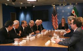 Leaders of the Syrian National Coalition sit opposite Secretary of State John Kerry at the U.S. Mission to the U.N. in New York City. July 25, 2013. Photo: Luke Vargas/TRNS