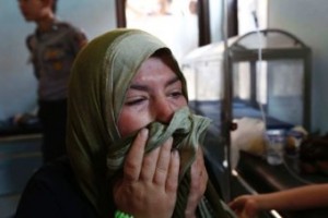 Nadine Bakour, a Lebanese woman who lost her husband and two sons in the accident, cries in a health clinic.