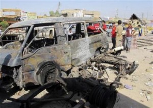 Civilians gather at the site of Tuesday's bomb attack in Baghdad