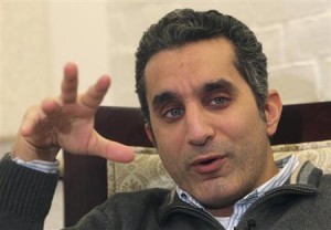 Popular Egyptian satirist Bassem Youssef gestures as he talks during an interview with Reuters in Cairo