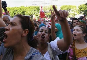 Protesters shout slogans during demonstration to call for departure of the Islamist-led ruling coalition in Avenue Habib-Bourguiba in central Tunis