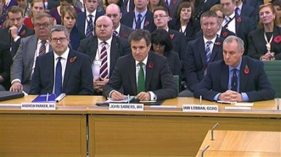 Andrew Parker the head of M15, John Sawers the head of M16 and Iain Lobban GCHQ director (L-R) are seen attending an Intelligence and Security Committee hearing at Parliament, in this still image taken from video in London November 7, 2013. REUTERS/UK Parliament via REUTERS TV