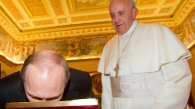 Russian President Vladimir Putin bends to kiss an icon of the Madonna as Pope Francis looks at him on the occasion of their private audience at the Vatican, Monday, Nov. 25, 2013. (AP / Claudio Peri) Read more: http://www.ctvnews.ca/world/putin-shows-his-religious-side-during-vatican-meeting-with-pope-francis-1.1559723#ixzz2lhCS5etb