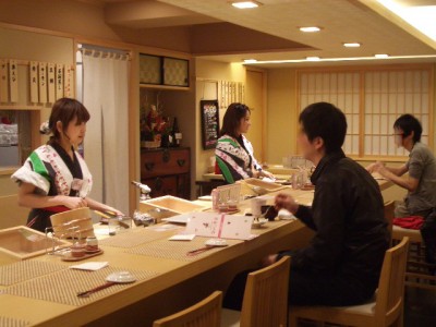 Women making  and serving Sushi at a Japanese Restaurant in Tokyo