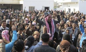Residents gather to protest near the house of Alwani, in Ramadi