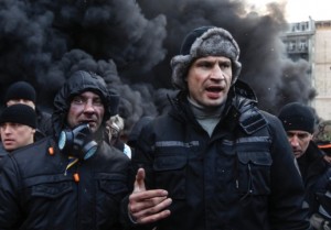 Opposition leader, Vitaly Klitschko, right, talks to pro-European integration protesters. Photograph: Vasily Fedosenko/Reuters