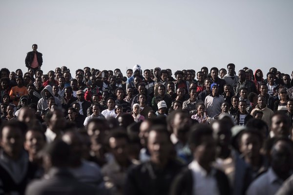 African asylum seekers outside the American Embassy in Tel Aviv on Monday. They were protesting their treatment and demanding recognition as refugees.