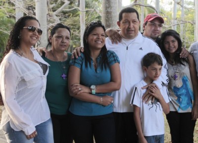 Venezuela President Hugo Chávez surrounded by his family members including; daughter Rosa Virginia, left, an unidentified friend, daughter Maria Gabriela, third left, son Hugo Rafael Jr. standing behind Chávez, second from right, granddaughter Gabriela, right, and his grandson Manuel, standing in front