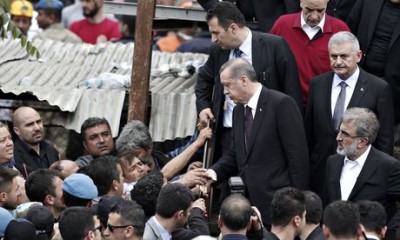 Recep Tayyip Erdogan talks to relatives of miners in Soma. Photograph: Osman Orsal/Reuters