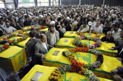 Funeral of Hezbollah fighters killed in Syria. Iran is now recruiting  Shitte refugees from Afghanistan  to fight the Sunni rebels  in Syria and reduce the  mounting casualties  f Hezbollah fighters 