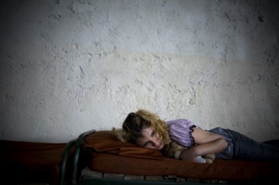 Mina, a 24-year-old drug addict, sleeps with her teddy bear at a substance-abuse rehab center for women on the western outskirts of Tehran. Mina grew up with addicted parents. She started using drugs when she was 19. (Maryam Rahmanian/For The Washington Post)
