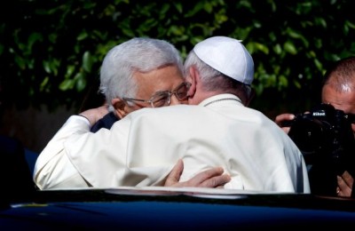 Palestinian President Mahmoud Abbas, left, and Pope Francis hug each other as Francis arrives at the Palestinian Authority headquarters in the West Bank city of Bethlehem on Sunday, May 25, 2014. Francis landed Sunday in the West Bank town of Bethlehem in a symbolic nod to Palestinian aspirations for their own state as he began a busy second day of his Mideast pilgrimage. Photo: Nasser Nasser, AP