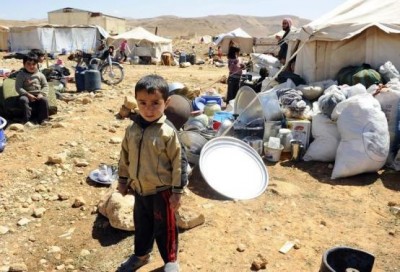 A Syrian refugee child who fled the violence from the Syrian town of Flita, near Yabroud, poses for a photograph at the border town of Arsal, in the eastern Bekaa Valley March 20, 2014.  CREDIT: REUTERS/HASSAN ABDALLAH