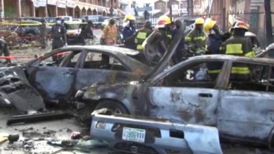 Witnesses to the powerful explosion say body parts were scattered around the exit to Emab Plaza, in the upscale Wuse 11 suburb of Nigeria's capital city. (Olamikan Gbemiga/Associated Press)