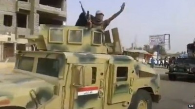 ISIS militants overran the town of Baiji last week, seizing abandoned  Iraqi army military vehicles