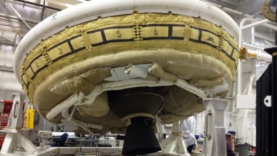 In this undated file photo provided by NASA, a saucer-shaped test vehicle known as a Low Density Supersonic Decelerator is shown in the Missile Assembly Building at the US Navy's Pacific Missile Range Facility at Kekaha on the island of Kauai in Hawaii.AP/NASA