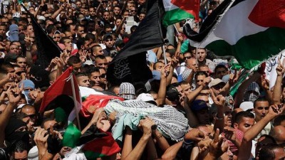 Palestinians protest during the funeral of Muhammad Abu Khdeir. A preliminary autopsy report shows that 16-year-old Abu Khdeir was burnt alive by his kidnappers, a senior Palestinian official said late Friday