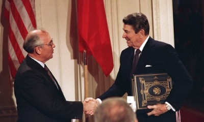 Int this Dec. 8, 1997, file photo, U.S. President Ronald Reagan, right, shakes hands with Soviet leader Mikhail Gorbachev after the two leaders signed the Intermediate Range Nuclear Forces Treaty to eliminate intermediate-range missiles during a ceremony in the White House East Room in Washington. In an escalation of tensions, the Obama administration accused Russia on July 28, 2014, of conducting tests in violation of a 1987 nuclear missile treaty, calling the breach "a very serious matter" and going public with allegations that have simmered for some time. The treaty confrontation comes at a highly strained time between President Barack Obama and Russian President Vladimir Putin over Russia's intervention in Ukraine and Russia's grant of asylum to National Security Agency leaker Edward Snowden.(AP Photo/Bob Daugherty, File)