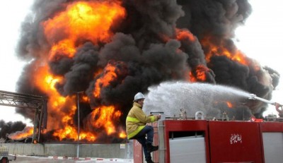 A Palestinian firefighter works during efforts to extinguish a fire at Gaza's main power plant, which witnesses said was hit in Israeli shelling, in the central Gaza Strip July 29, 2014. Photo by Reuters