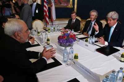 Iran's Foreign Minister Mohammad Javad Zarif, left, meets with U.S. Secretary of State John Kerry, right, at talks between the foreign ministers of the six powers negotiating with Tehran on its nuclear program in Vienna on Sunday. Associated Press