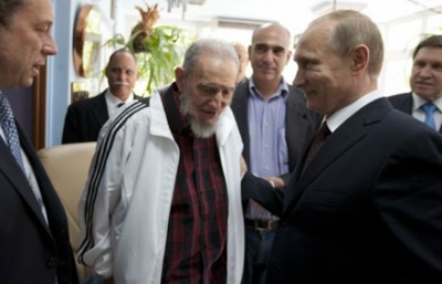 Cuba's former leader Fidel Castro, center, meets with Russia's President Vladimir Putin, right, in Cuba on Friday. Putin began a Latin American tour to boost trade in the region.