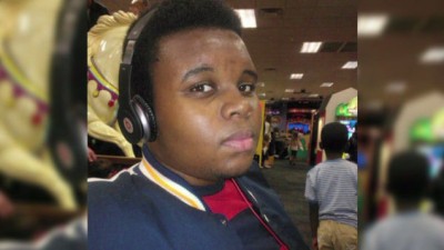 According to an incident report released by Ferguson, Mo. police today, Michael Brown was suspected in a convenience store robbery that police say precipitated his shooting by officer Darren Wilson. The report alleges that Brown (accompanied by Dorian Johnson) stole a box of cigarettes and got into a brief altercation with the store's clerk before leaving.