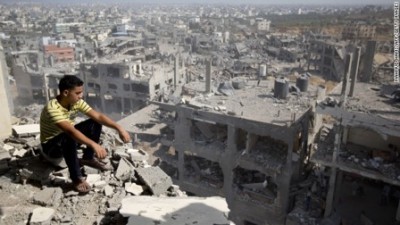 A Palestinian man looks out over destruction in the al-Tufah neighborhood of Gaza City, Gaza, on Wednesday, August 6, as a fragile 72-hour cease-fire between Israel and Hamas entered its second day. Israel launched a ground operation in Gaza on July 17 after a 10-day campaign of airstrikes had failed to halt relentless Hamas rocket fire on Israeli cities.