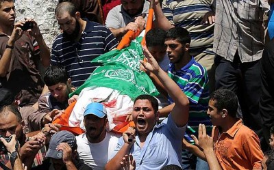 Palestinians carry the body of the wife of Mohammed Al Deif Photo: EPA