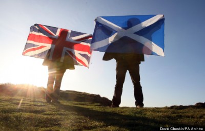 Scottish and English flags held up over Edinburgh,Scotland