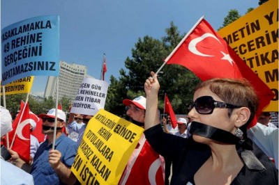 Civil servants stage a protest outside the Foreign Ministry in Ankara, Turkey, on July 17, demanding the release of 49 officials seized by Islamic militants in June at the Turkish consulate in Mosul, Iraq 