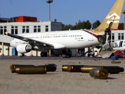 Bullet casings and damaged airplanes sit on the tarmac at Tripoli international airport on Aug. 26 after fighters from the Libyan Dawn coalition captured the airport. (Photo: Mahmud Turkia, AFP/Getty Images)