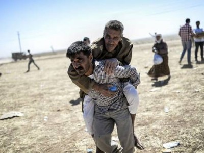 70,000 Syrian Kurds are reported to have fled to the border with Turkey (AFP)