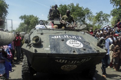 Nigerian soldiers display one of the captured Boko Haram armoured vehicles last September [EPA]